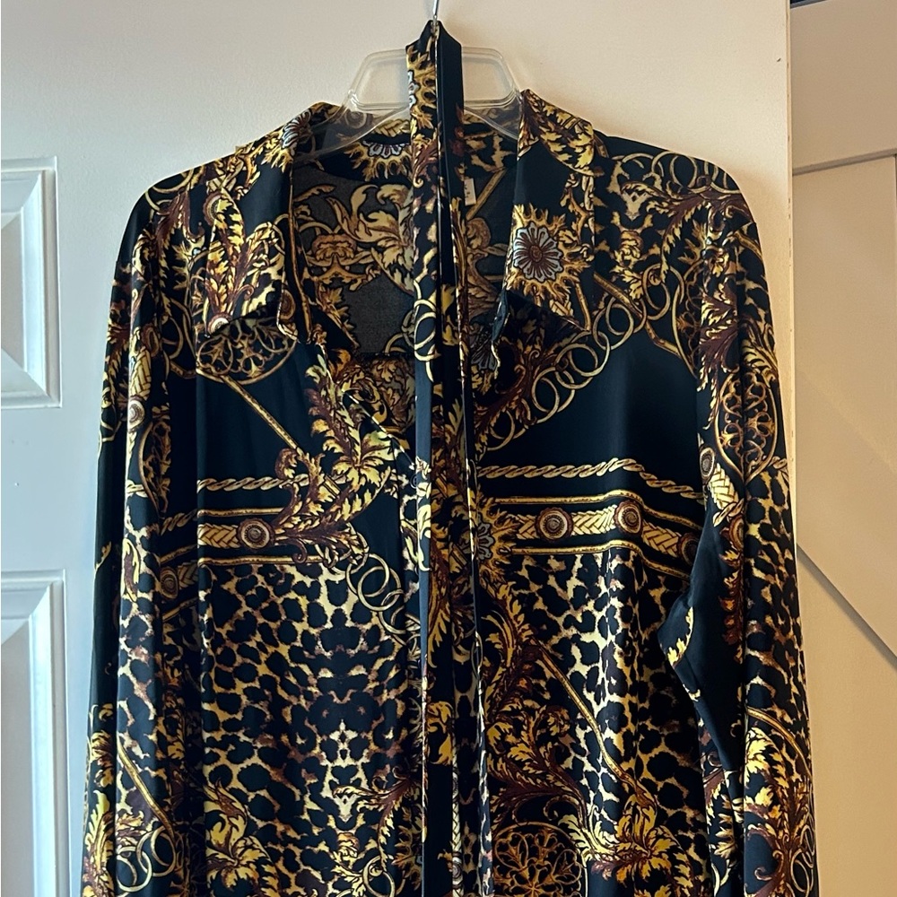 This pretty dress has never been worn. It is straight cut and fits nicely.